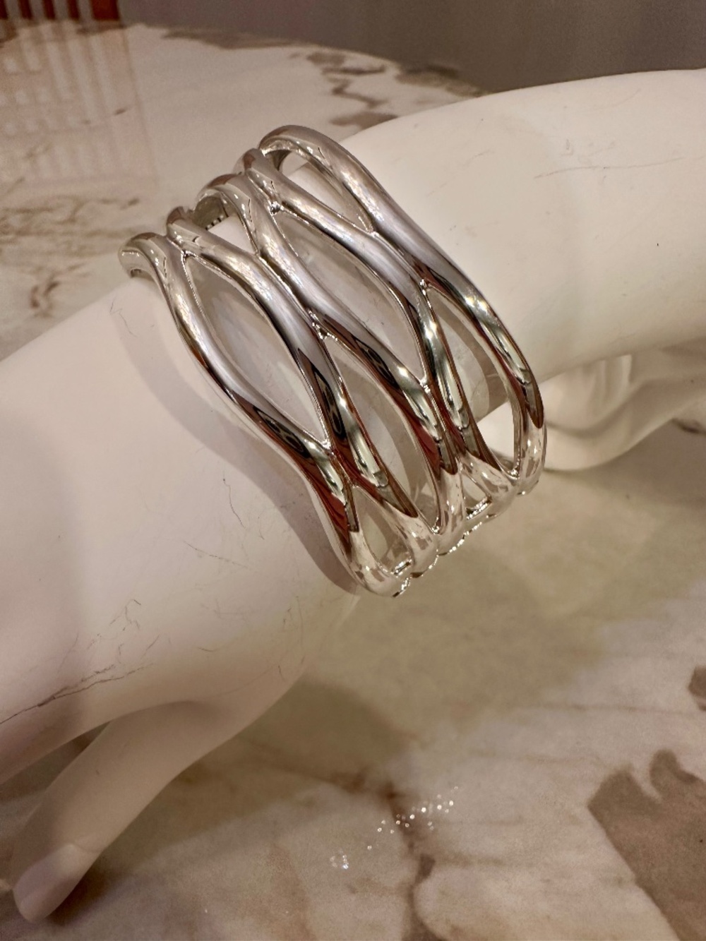 Robert Lee Morris silver plated cuff bracelet with wavy, interlocking design. Si